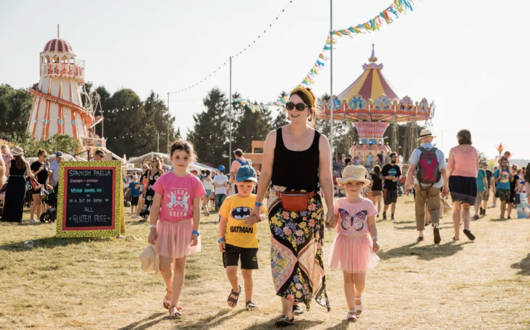 Woman and three children holding hands at The Big Feastival festival